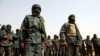 FILE - Malian troops join with former members of the Tuareg rebellion for a joint patrol in Gao, Mali, Feb. 23, 2017. Mali’s military rulers ended a 2015 peace deal with Tuareg rebels in the country’s north, a government spokesperson said Jan. 25, 2024. 