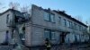 This handout photograph taken and released by Ukrainian Emergency Service on Nov. 25, 2023, shows a rescuer working at the site of a drone attack in Kyiv. (Photo by Handout / Ukrainian Emergency Service / AFP)