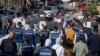Palestinian journalists carry mock coffins of colleagues killed during the current Israel-Hamas war, during a symbolic funeral procession toward a United Nations office in the West Bank city of Ramallah, Nov. 7, 2023.