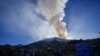 The sun rises during a forest fire on El Cable Hill in Bogota, Colombia, Jan. 25, 2024.