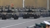 FILE - The Japan Ground Self-Defense Force tanks parade during the Self-Defense Forces Day at Asaka Base in Asaka, north of Tokyo, on Oct. 23, 2016.