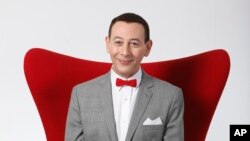 FILE - Actor Paul Reubens portraying Pee-wee Herman poses for a portrait while promoting "The Pee-wee Herman Show" live stage play, Dec. 7, 2009, in Los Angeles.