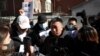 A man surnamed Fu, who lost his brother, reacts as he speaks to the media following a court hearing on compensation for those who lost their loved ones on the Malaysia Airlines flight MH370 that went missing in 2014, in Beijing, China, Nov. 27, 2023.