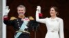 Denmark's King Frederik X and Denmark's Queen Mary wave from the balcony of Christiansborg Palace in Copenhagen, Jan. 14, 2024. 