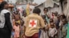 Red Cross officials create awareness of mpox in the Don Bosco refugee camp in Goma, Democratic Republic of the Congo, Aug. 22, 2023.