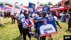 Supporters hold a placard depicting Mahamudu Bawumia, vice president of Ghana and presidential candidate of the New Patriotic Party NPP for the 2024 presidential elections, in Takoradi, Ghana, Aug. 18, 2024.