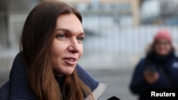 FILE - Tennis player Simona Halep of Romania speaks to the media, after a hearing for a doping case against her, at the Court of Arbitration for Sport (CAS) in Lausanne, Switzerland, Feb. 9, 2024. 