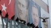 Posters of Mustafa Kemal Ataturk (L) founder of modern Turkey, and current President Recep Tayyip Erdogan are displayed at the Spice Bazaar plaza, during the re-opening ceremony following its restoration in Istanbul, May 4, 2018. 