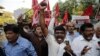 Members of Dalit organizations and leftist groups shout slogans as they hold placard during a protest in Mumbai, India, April 2, 2018.