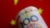 FILE - A China yuan note is seen in this illustration, May 31, 2017.