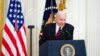 President Joe Biden speaks during an event to celebrate Equal Pay Day and Women's History Month in the East Room of the White House, in Washington, March 15, 2022. 