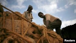 Men unload sacks of khat in Mandera, northeastern Kenya, Nov. 2007 file photo.