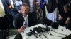 FILE - Tariq Ramadan talks to the media after a conference at the Er-Rahma mosque in Nantes, western France, April 25, 2010. 
