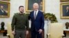 FILE- President Joe Biden poses for a photo with Ukrainian President Volodymyr Zelenskyy in the Oval Office of the White House, in Washington, Dec. 21, 2022.