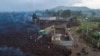 Lava from the eruption of Mount Nyiragongo cuts through Buhene north of Goma, Democratic Republic of Congo.