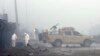 Security forces inspect the site of a suicide bomb attack in Kabul, Afghanistan, Nov. 29, 2018. Taliban insurgents staged a deadly coordinated attack targeting a British security firm in the Afghan capital Wednesday.