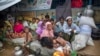 Rohingya Muslims, who crossed over from Myanmar into Bangladesh, rest inside a school compound at Kutupalong refugee camp, Bangladesh, Monday, Oct. 23, 2017. 
