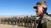 FILE - U.S. Army General John Nicholson, commander of Resolute Support forces and U.S. forces in Afghanistan, speaks with Afghan police special forces after they took part in a military exercise in Logar province, Afghanistan, Nov. 30, 2017.