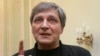 FILE - Television journalist Alexander Nevzorov speaks in St. Petersburg, Feb. 24, 2012. A court in Moscow on Wednesday sentenced Nevzorov in absentia to eight years in prison.