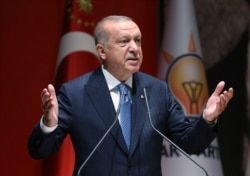 Turkey's President Recep Tayyip Erdogan addresses his ruling party members, in Ankara, Turkey, July 26, 2019.