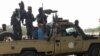 Soldiers of the Chad Army sit on the back of a Land Cruiser at the Koundoul market, 25 km from N'Djamena, on Jan. 3, 2020, upon their return after a months-long mission fighting Boko Haram in Nigeria.
