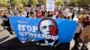 FILE - Upset with President Barack Obama's immigration policy, about 250 people march to the U.S. Immigrations and Customs Enforcement office with a goal of stopping future deportations in Phoenix, Arizona. 