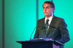Brazilian President Jair Bolsonaro speaks during the Brazil-United Arab Emirates Business Forum in the Emirati capital Abu Dhabi, Oct. 27, 2019.