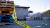 Police tape marks off the scene of a shooting off Cabrillo Highway, Jan. 24, 2023, after a gunman killed several people at two agricultural businesses in Half Moon Bay, California. 