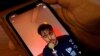 FILE - A video of Iranian singer Shervin Hajipour plays on a phone in Nicosia, Cyprus, Oct. 4, 2022. 