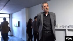 Mikail Kirbayir attends the opening of an art exhibition in Istanbul honoring victims of enforced disappearances. His brother, Cemil Kirbayir, disappeared after the 1980 military coup in Turkey. (D. Jones/VOA)
