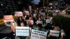 South Korean protesters react during a rally about the General Security of Military Information Agreement, or GSOMIA, in front of Japanese embassy in Seoul, South Korea, Thursday, Aug. 22, 2019. 