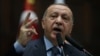 FILE - Turkish President Tayyip Erdogan addresses members of parliament from his ruling AK Party (AKP) during a meeting at the Turkish parliament in Ankara, Jan. 8, 2019. 