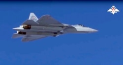 This photo made from footage taken from the Russian Defense Ministry official website on Nov. 20, 2018, shows a Russian Su-57 fighter jet over Syria.