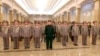 North Korean leader Kim Jong Un (C) visits the Kumsusan Palace of the Sun on the 72nd birth anniversary of North Korea's late leader Kim Jong Il in this photo released by North Korea's Korean Central News Agency on February 16, 2014. 