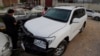 Pakistani journalists examine a car of American diplomate parked inside a police station after an accident in Islamabad, April 7, 2018.
