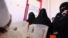 Women wait to receive supplemental nutrition shakes, at malnutrition treatment ward of al-Sabeen hospital in Sana'a, Yemen, Feb. 24, 2021. 