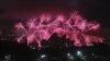 FILE - Fireworks explode behind Sydney's Opera House during New Year's celebrations, Australia, Dec. 31, 2013.