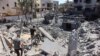Palestinians gather amid the rubble near a fuel tank damaged in Israeli bombing in Gaza City on Sept. 14, 2024.