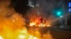 A man stands between bonfires lit by demonstrators as they clashed with police during an anti-government protest in Rio de Janeiro, Brazil, June 20, 2013. 