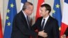 French President Emmanuel Macron greets Turkish President Recep Tayyip Erdogan during a joint news conference at the Elysee Palace in Paris, France, Jan. 5, 2018.