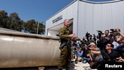 FILE - Israeli military spokesperson Rear Admiral Daniel Hagari speaks to the media as Israel's military displays what they say is an Iranian ballistic missile, in southern Israel April 16, 2024.