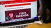 An Arsenal fan looks at the website of England's Arsenal football Club that shows Rwanda's new tourism promotion logo in Kigali on May 23, 2018.