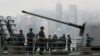 U.S. sailors of the USS Antietam (CG-54) from the George Washington Battle Group stand on the deck before sailing to the Philippines at Hong Kong Victoria Harbor, Nov. 12, 2013.