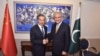 Pakistan's Foreign Minister Shah Mehmood Qureshi shakes hand with Chinese State Councilor and Foreign Minister Wang Yi at the Ministry of Foreign Affairs in Islamabad, Pakistan, Sept. 8, 2018. (Ministry of Foreign Affairs handout via Reuters).