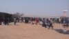 FILE - Migrants expelled from Algeria complain about conditions in a transit camp in Agadez, Niger, Dec. 9, 2016. (I. Abdoul-Razak/VOA)