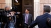 Italian Premier-designate Giuseppe Conte (C) is approached by journalists as he leaves his home, in Rome, May 24, 2018. 