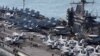U.S. aircrafts sit on the flight deck of the USS George Washington at a navy port in Busan, South Korea, Oct. 4, 2013.