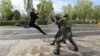 FILE - Border police take part in an anti-terrorism drill near Baketu border in Tacheng, Xinjiang Uighur Autonomous Region, China, April 28, 2016.