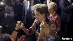 Brazil's President Dilma Rousseff greets women during a rally in support of her and against her impeachment in front of Planalto Palace in Brasilia, April 19, 2016.