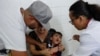 A boy cries as he receives a vaccine against yellow fever at a public health center in Sao Paulo, Brazil, Jan. 16, 2018. 